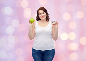 Image showing happy plus size woman choosing apple or cookie