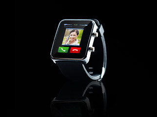 Image showing close up of black smart watch with incoming call