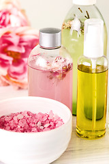 Image showing Spa setting with pink roses and aroma oil, vintage style 