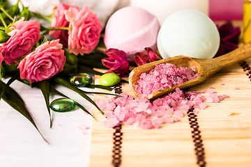 Image showing Spa setting with pink roses and aroma oil, vintage style 