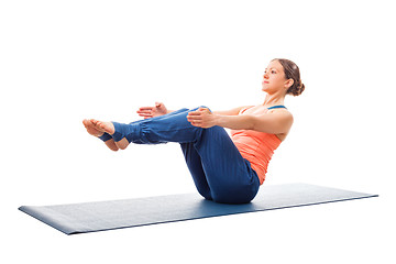 Image showing Sporty fit woman doing Ashtanga Vinyasa yoga asana Paripurna nav