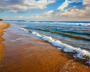 Image showing Wave surging on sand