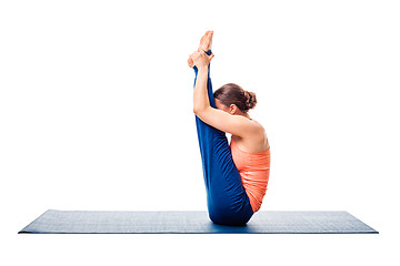 Image showing Woman doing Ashtanga Vinyasa yoga asana Urdhva mukha paschimotta