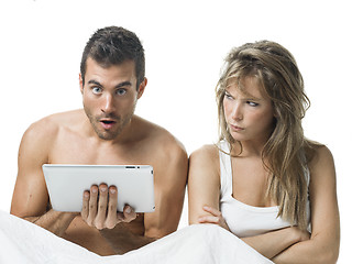 Image showing uncommunicative couple on bed in white 