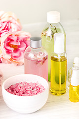 Image showing Spa setting with pink roses and aroma oil, vintage style 