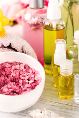 Image showing Spa setting with pink roses and aroma oil, vintage style 