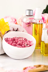 Image showing Spa setting with pink roses and aroma oil, vintage style 