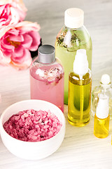 Image showing Spa setting with pink roses and aroma oil, vintage style 