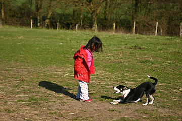 Image showing Child and dog