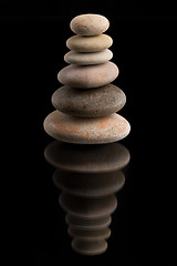 Image showing balancing zen stones on black