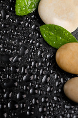 Image showing zen stones on black with water drops