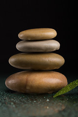Image showing balancing zen stones on black