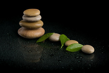 Image showing balancing zen stones on black