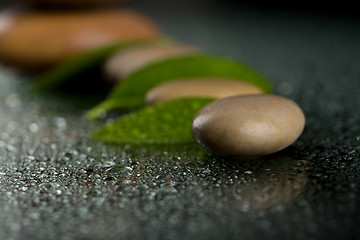 Image showing zen stones on black with water drops