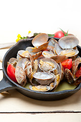 Image showing fresh clams on an iron skillet