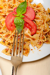 Image showing Italian pasta farfalle butterfly bow-tie and tomato sauce