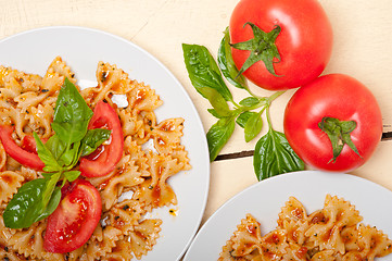 Image showing Italian pasta farfalle butterfly bow-tie and tomato sauce