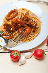 Image showing Italian seafood spaghetti pasta on red tomato sauce 