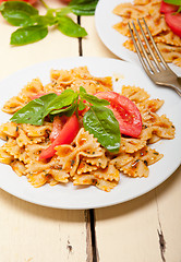 Image showing Italian pasta farfalle butterfly bow-tie and tomato sauce