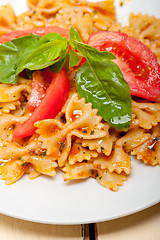 Image showing Italian pasta farfalle butterfly bow-tie and tomato sauce