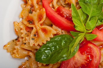 Image showing Italian pasta farfalle butterfly bow-tie and tomato sauce