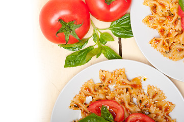 Image showing Italian pasta farfalle butterfly bow-tie and tomato sauce