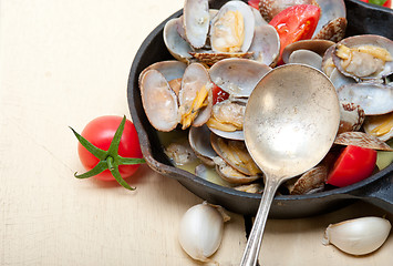 Image showing fresh clams on an iron skillet