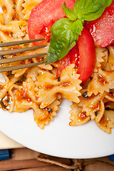 Image showing Italian pasta farfalle butterfly bow-tie and tomato sauce