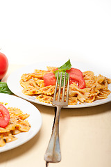 Image showing Italian pasta farfalle butterfly bow-tie and tomato sauce