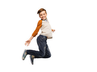 Image showing happy smiling boy jumping in air