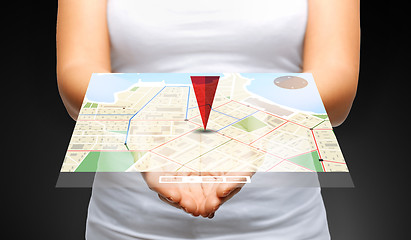 Image showing close up of womans hands showing gps navigator map