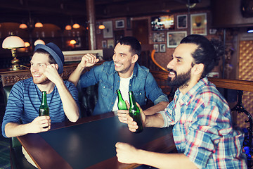 Image showing happy male friends drinking beer at bar or pub