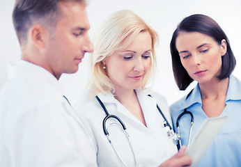 Image showing doctors looking at tablet pc