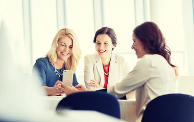 Image showing happy women with smartphone at restaurant