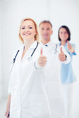 Image showing team of doctors showing thumbs up