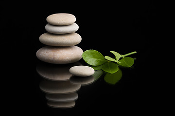 Image showing balancing zen stones on black