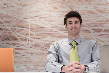 Image showing young business man  working on laptop  computer at modern office