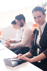 Image showing business woman on meeting  using tablet