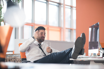 Image showing relaxed young business man at office