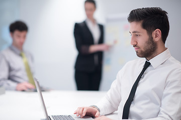 Image showing young business man at meeting