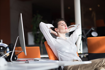 Image showing happy young business woman relaxing and geting insiration