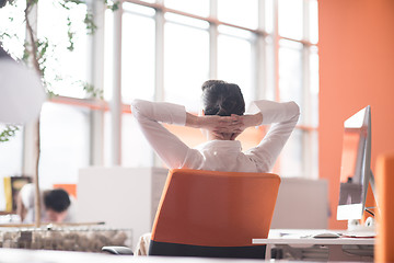 Image showing happy young business woman relaxing and geting insiration