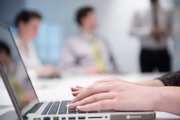 Image showing woman hands typing on laptop keyboard at business meeting