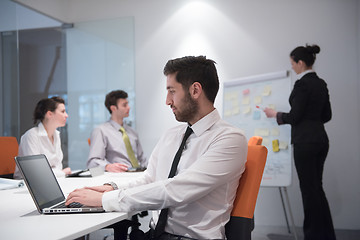 Image showing young business man at meeting