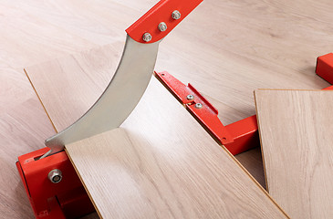 Image showing Red tool for cutting laminate