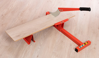 Image showing Red tool for cutting laminate