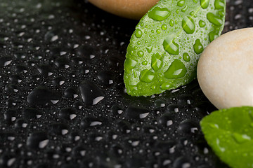 Image showing zen stones on black with water drops