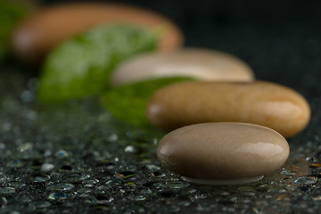 Image showing zen stones on black with water drops