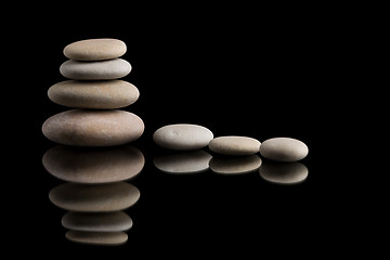 Image showing balancing zen stones on black