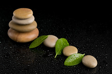 Image showing balancing zen stones on black